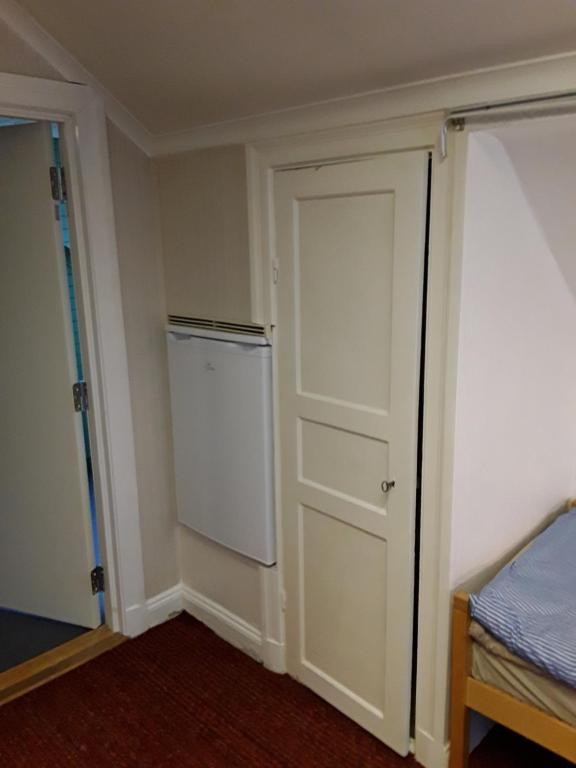 Postel nebo postele na pokoji v ubytování Knihsgården
