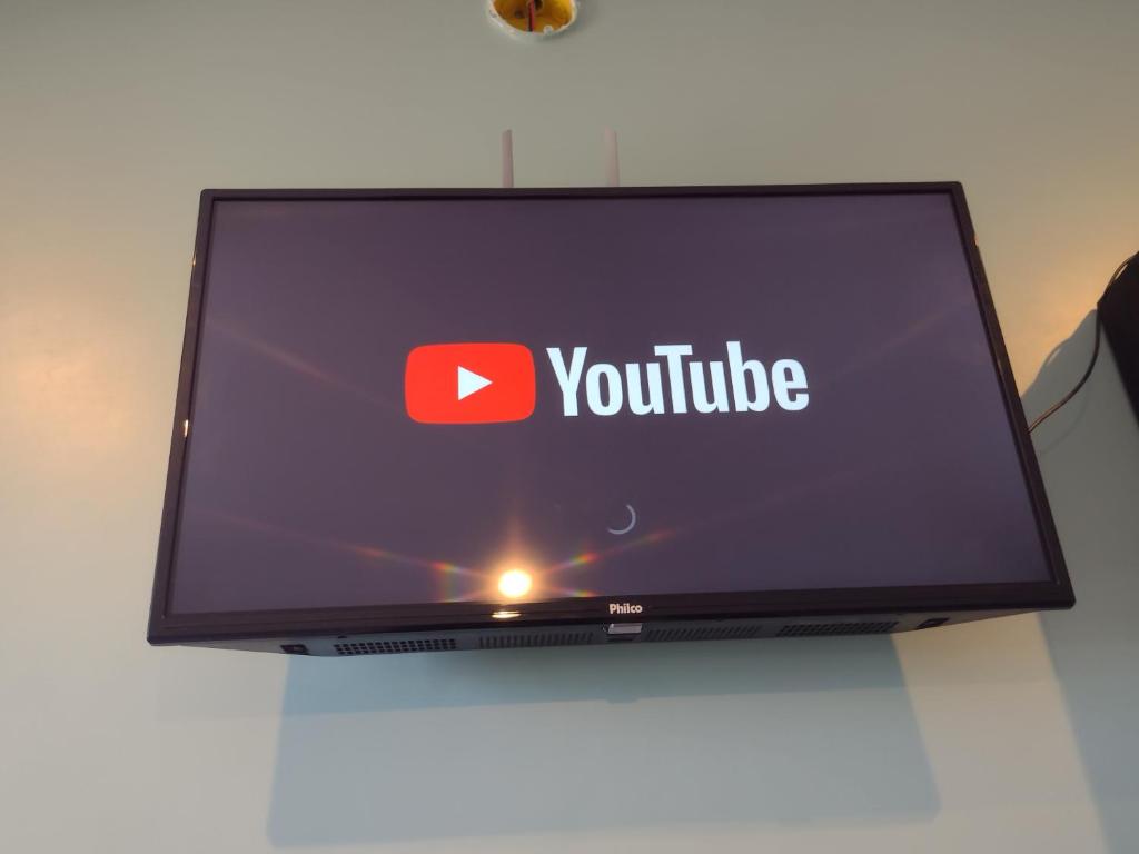 TV a/nebo společenská místnost v ubytování Pousada das Palmeiras