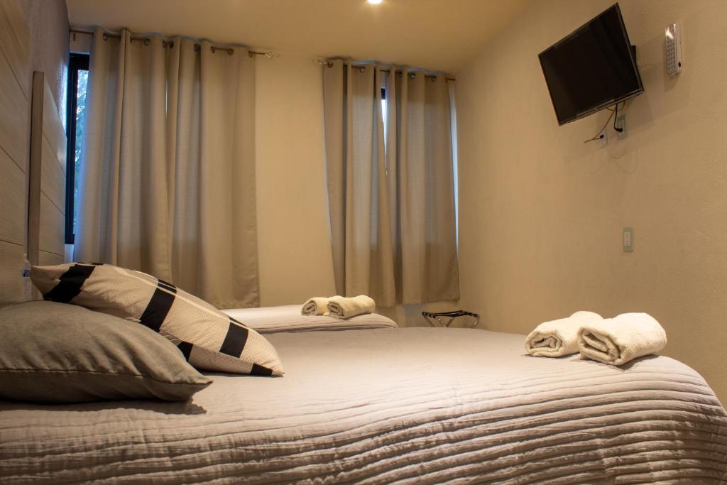 Postel nebo postele na pokoji v ubytování Hotel Hai Do