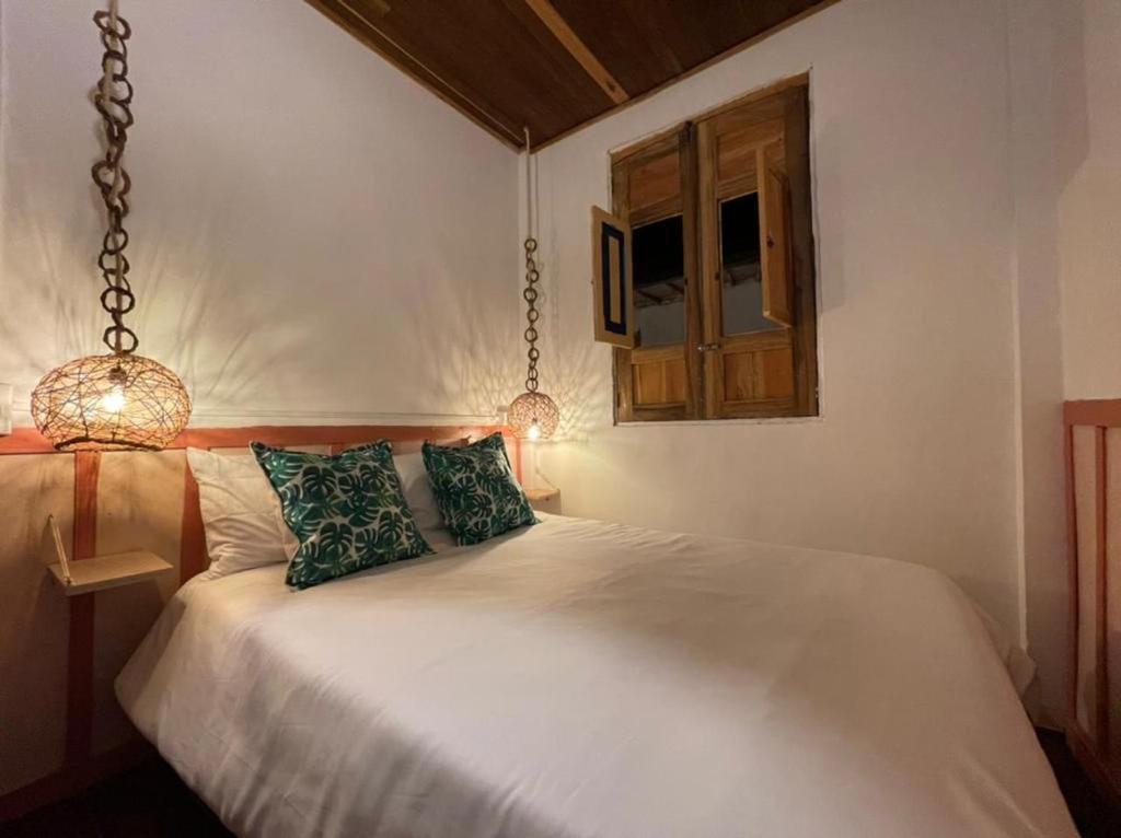 Voodi või voodid majutusasutuse Mahalo Hostel toas