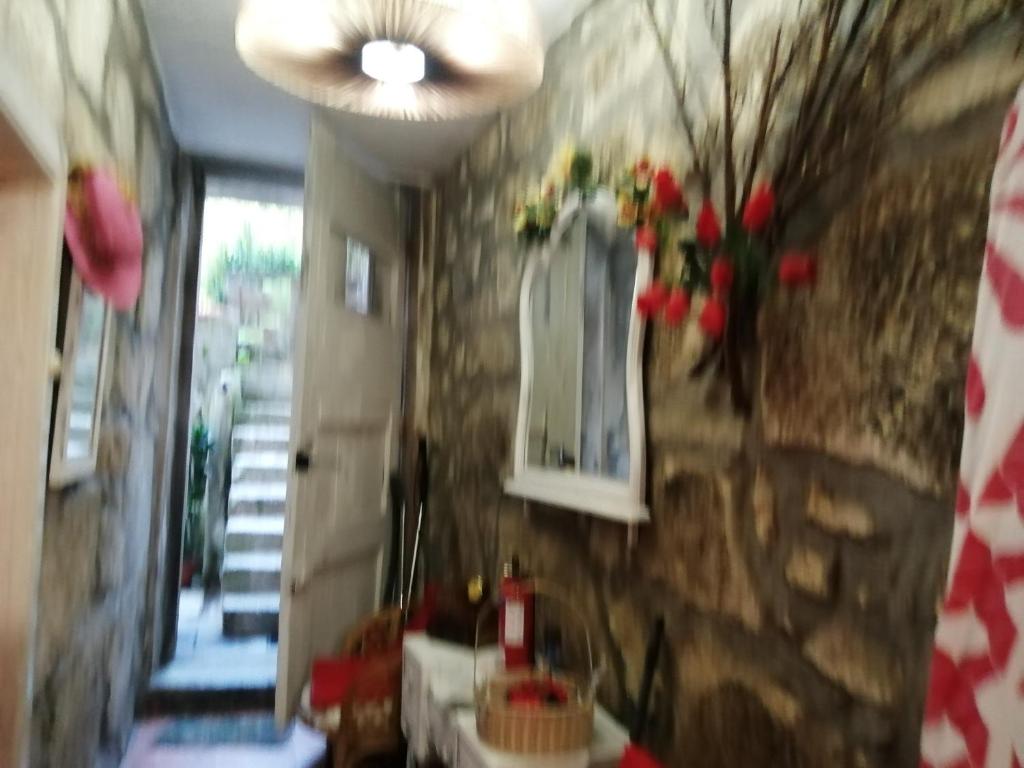 a room with a wall with flowers on it at AL-Pinheiro 62 in Porto