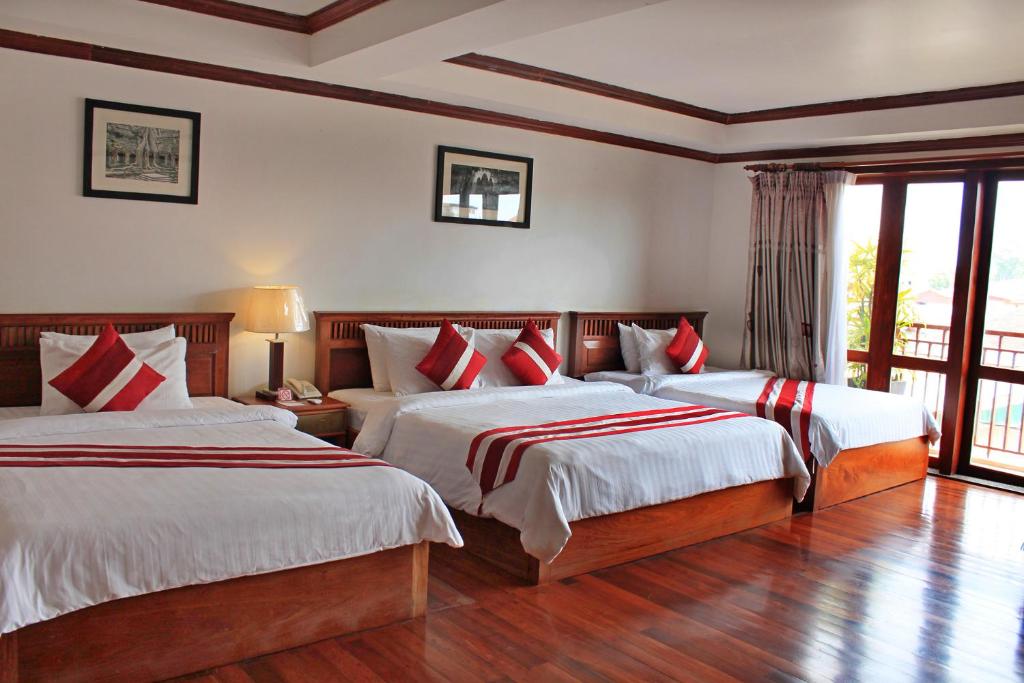 Postel nebo postele na pokoji v ubytování Cheathata CTS Hotel Siem Reap