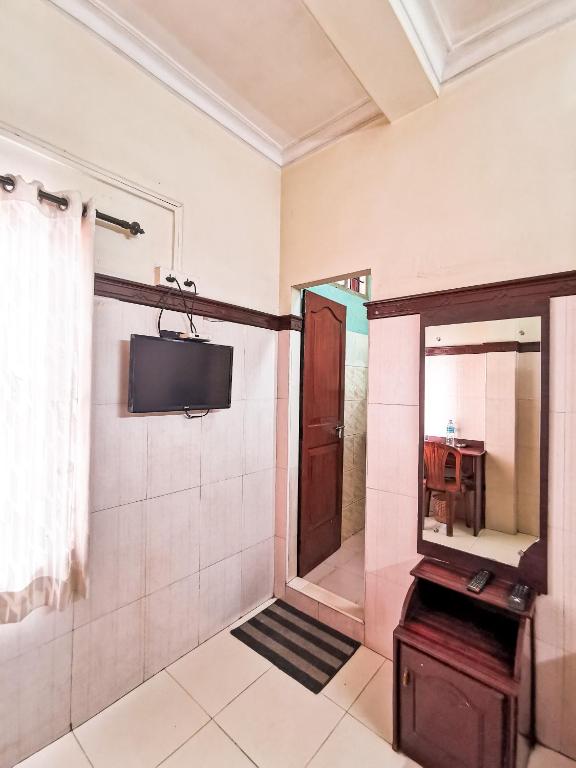 TV a/nebo společenská místnost v ubytování New AS Tourist Home Aluva