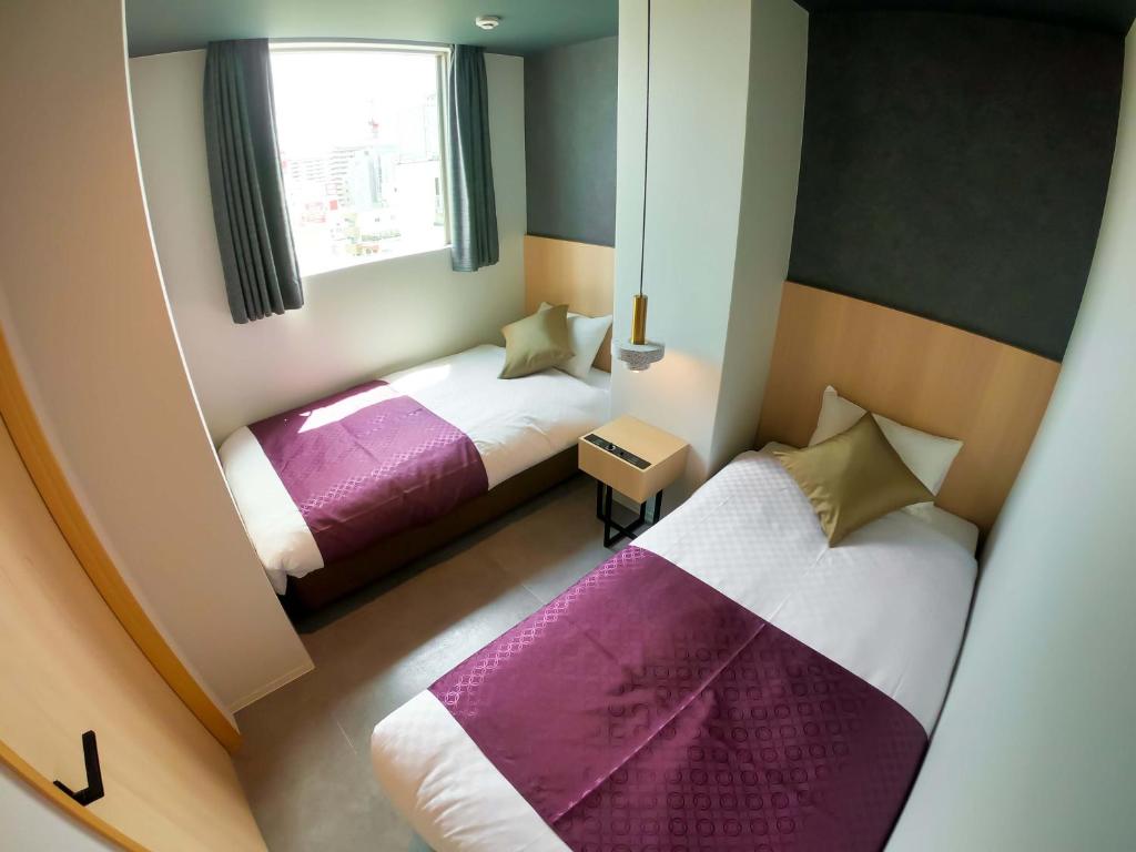Postel nebo postele na pokoji v ubytování Hotel S-Presso South
