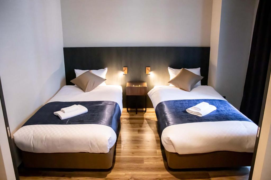 Postel nebo postele na pokoji v ubytování Hotel S-Presso South