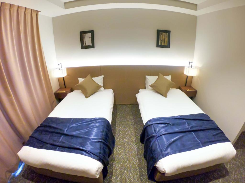 Postel nebo postele na pokoji v ubytování Hotel S-Presso South