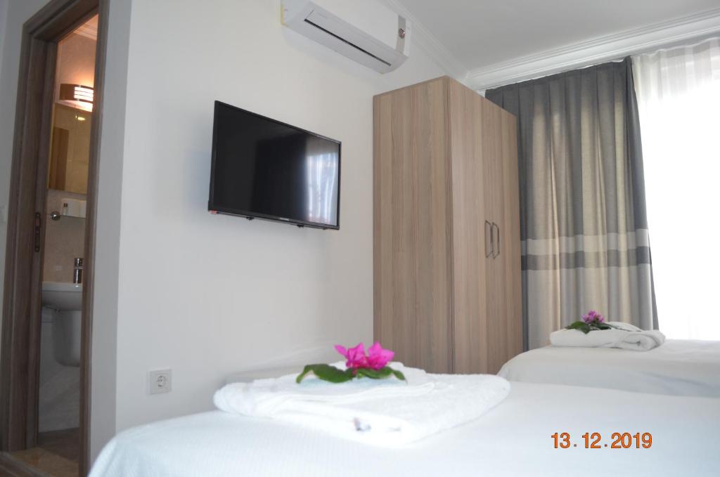 Postel nebo postele na pokoji v ubytování Hotel Uygar