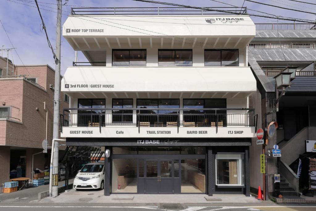a white van parked in front of a building at ITJ Base Shuzenji in Shuzenji