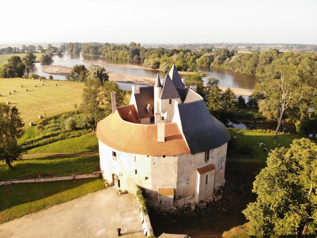 an aerial view of a castle with a river at Un château en Bourgogne in Saincaize-Meauce