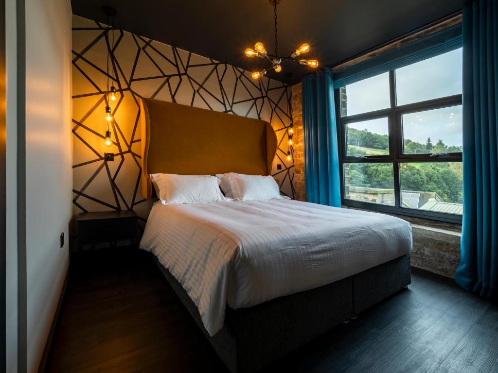 Postel nebo postele na pokoji v ubytování Bowers Mill Aparthotel