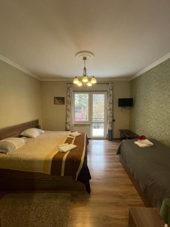 Postel nebo postele na pokoji v ubytování Garden Hotel Pasanauri since 1892