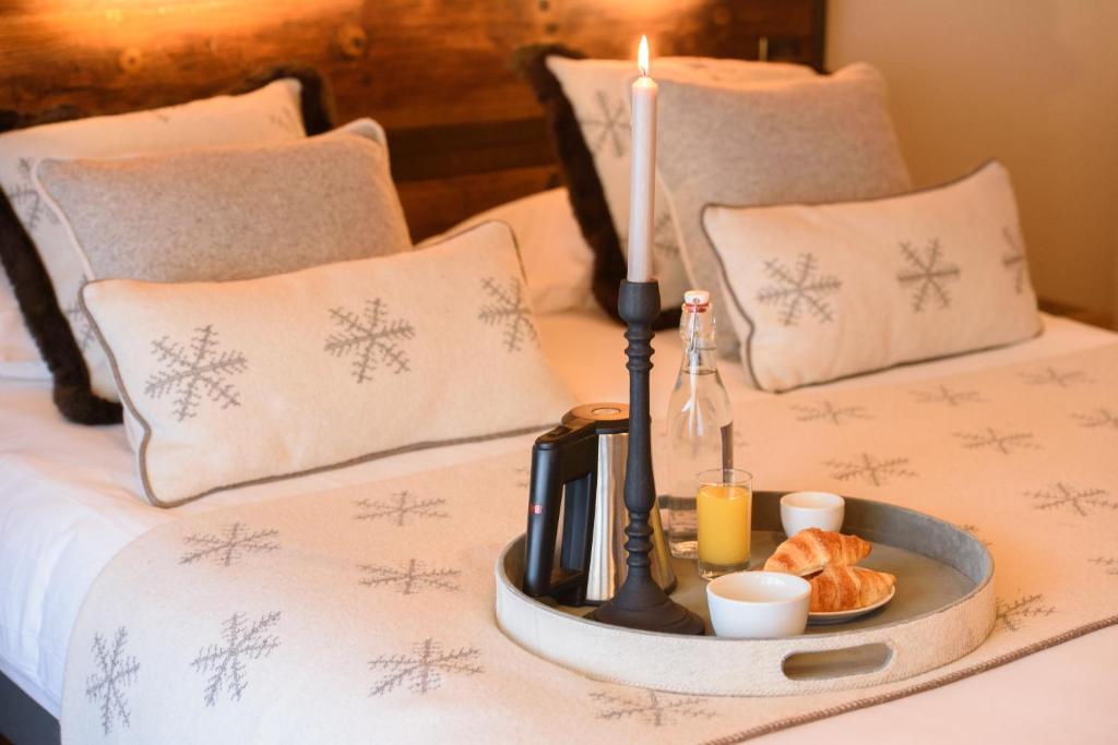 Postel nebo postele na pokoji v ubytování Hôtel Neste de Jade