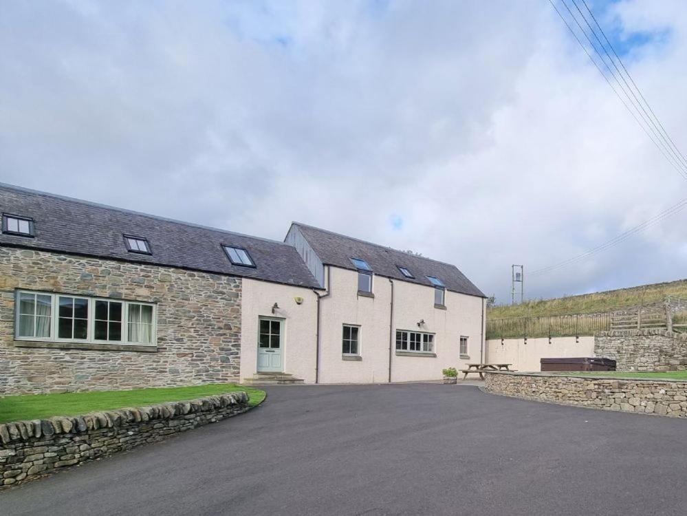 a large white building with a driveway in front of it at Time in Galashiels