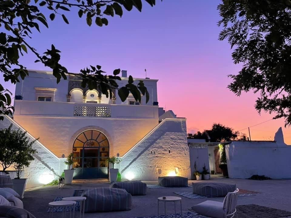 a view of a building at night at Tenuta Miro in Ostuni