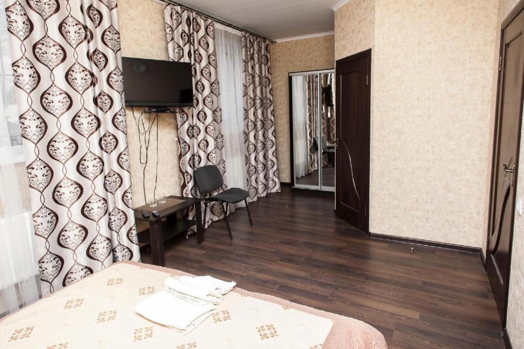 Postel nebo postele na pokoji v ubytování Chyhorinskyi Hotel
