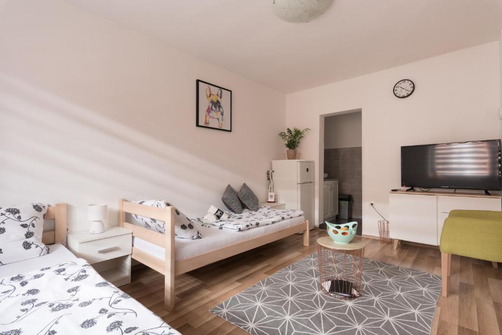 Ένα ή περισσότερα κρεβάτια σε δωμάτιο στο NunaNina apartmani