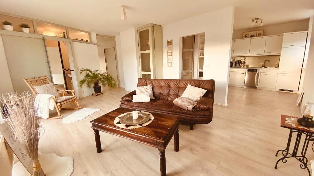 a living room with a couch and a coffee table at "Lodge Domblick" in Limburg an der Lahn