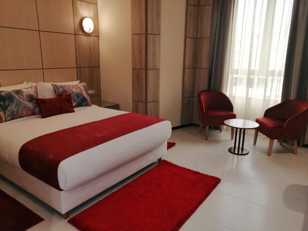 Postel nebo postele na pokoji v ubytování Hôtel Volubilis Meknès