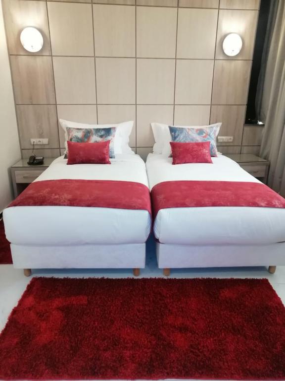 Postel nebo postele na pokoji v ubytování Hôtel Volubilis Meknès