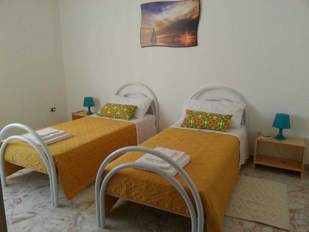 Posteľ alebo postele v izbe v ubytovaní La Via del Mare - Acireale Centro storico