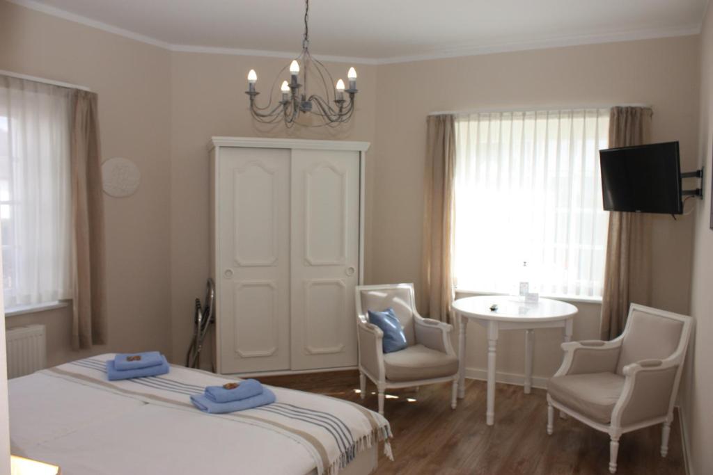 Postel nebo postele na pokoji v ubytování Hotel Maria