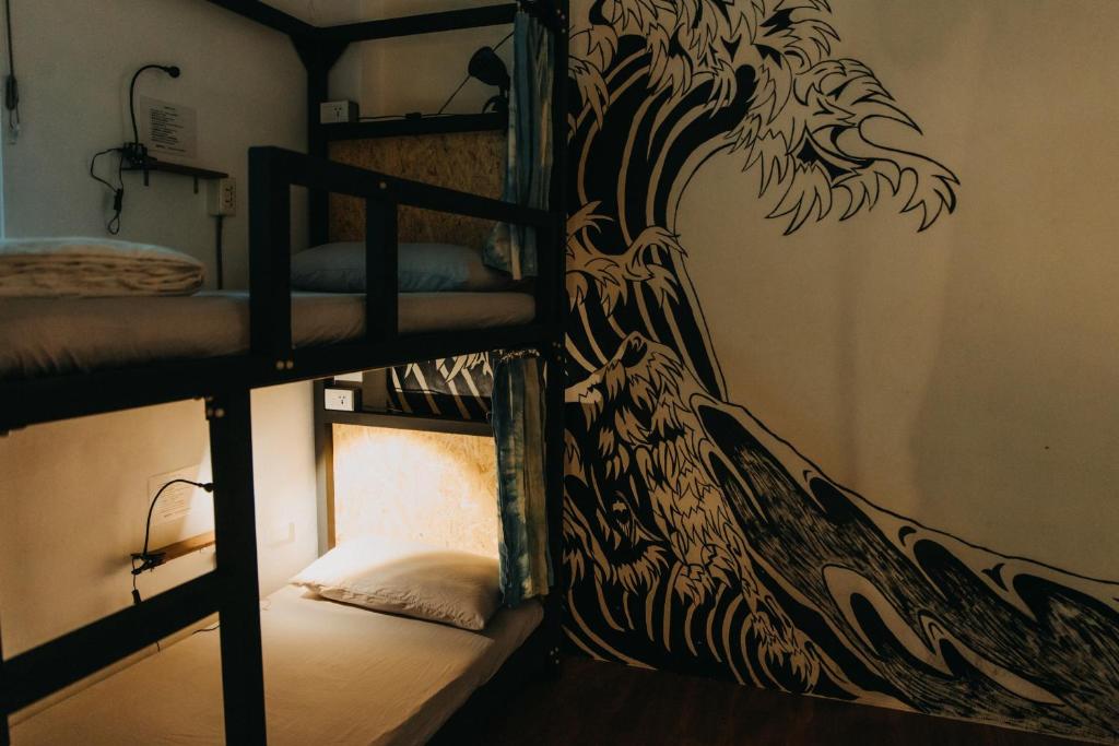 Postel nebo postele na pokoji v ubytování Lazy House