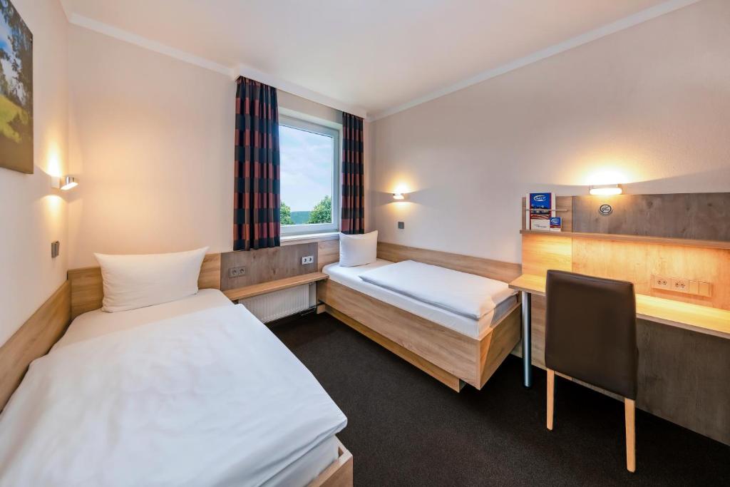 Postel nebo postele na pokoji v ubytování Hotel sleep & go