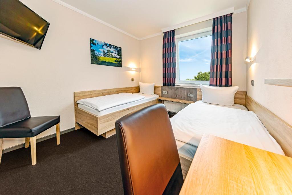 Postel nebo postele na pokoji v ubytování Hotel sleep & go
