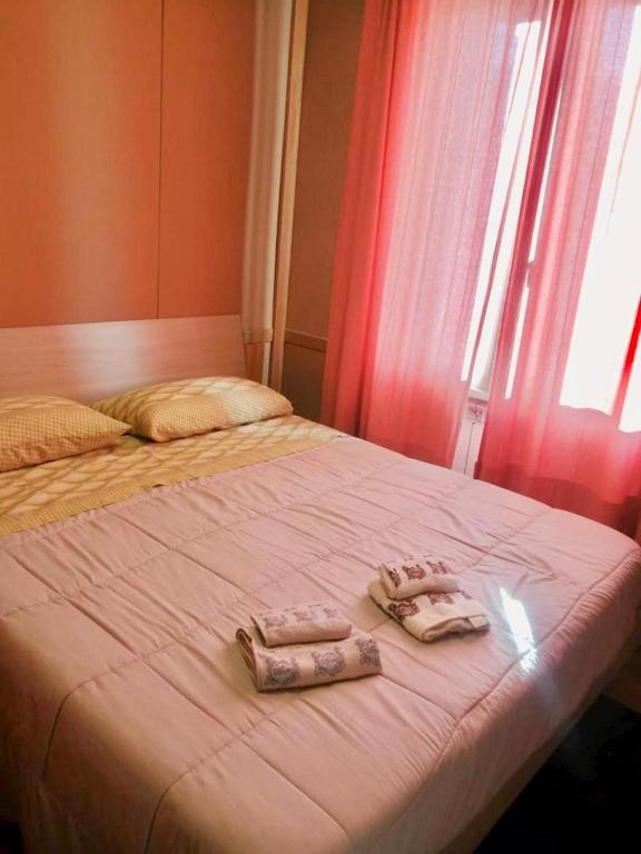 Postel nebo postele na pokoji v ubytování RESIDENCE ALTAIR Via Roma 13