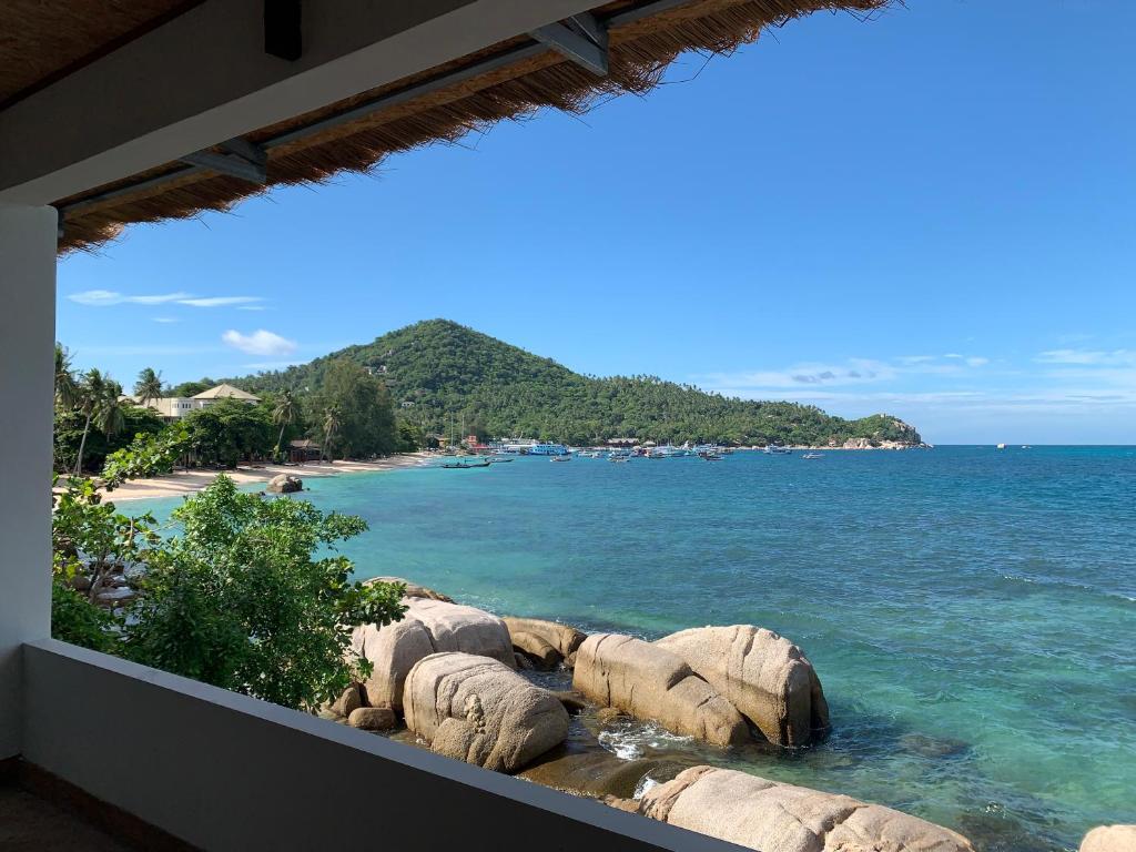 a view of the beach from the balcony of a resort at Koh Tao Heritage in Ko Tao