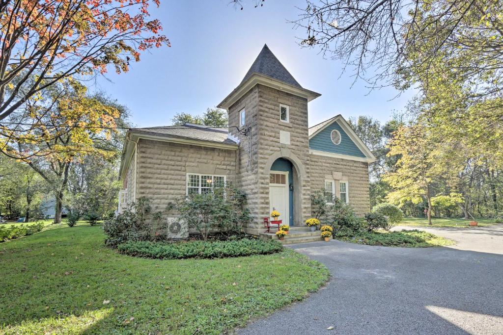 a brick house with a tower on top of it at Renovated WV Schoolhouse History Buffs Heaven! in Kearneysville