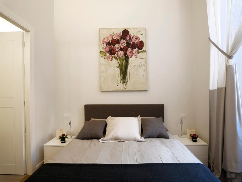 A bed or beds in a room at Antiche Residenze Romane Navona