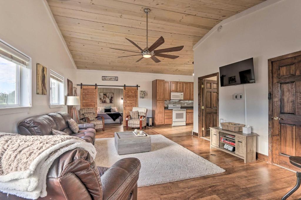 a living room with a couch and a ceiling fan at Equestrian Escape! Quiet Farm Stay Near Gettysburg in Keymar
