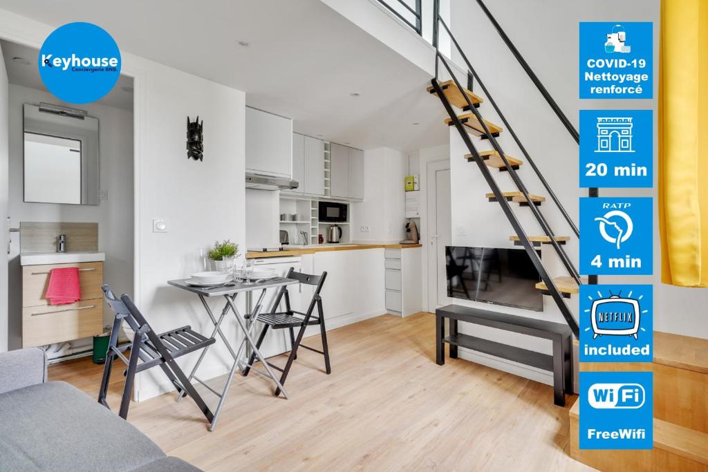 a kitchen and a living room with a staircase in a apartment at Studio mezzanine 3-4 pers tout équipé WIFI in Montreuil