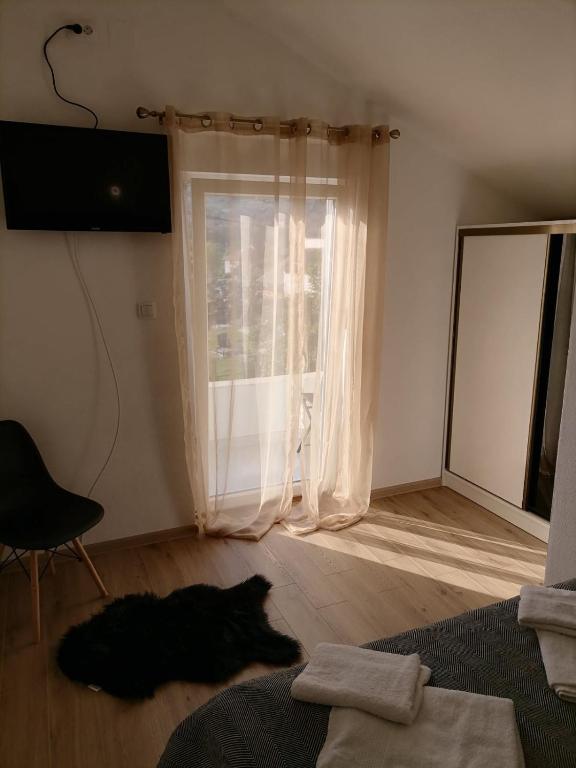 Postel nebo postele na pokoji v ubytování Drobnjak apartments