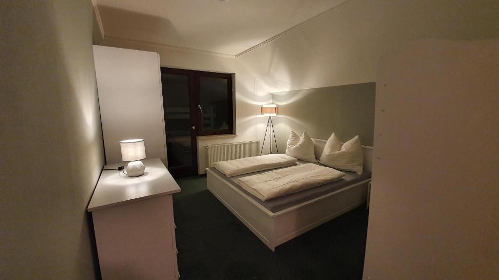 Postel nebo postele na pokoji v ubytování Hotel PlannerInn