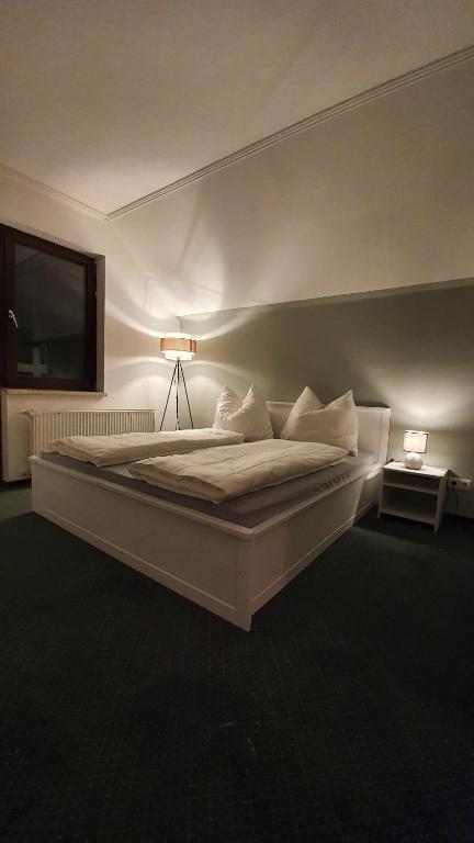 Postel nebo postele na pokoji v ubytování Hotel PlannerInn