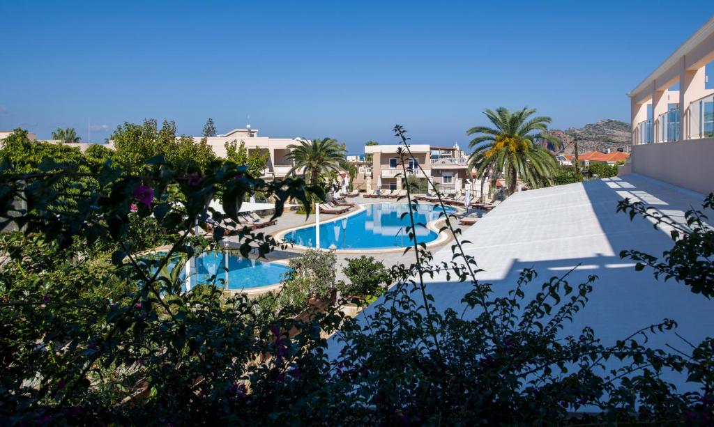 a view of the pool at a resort at Isida Hotel Agia Marina in Agia Marina Nea Kydonias