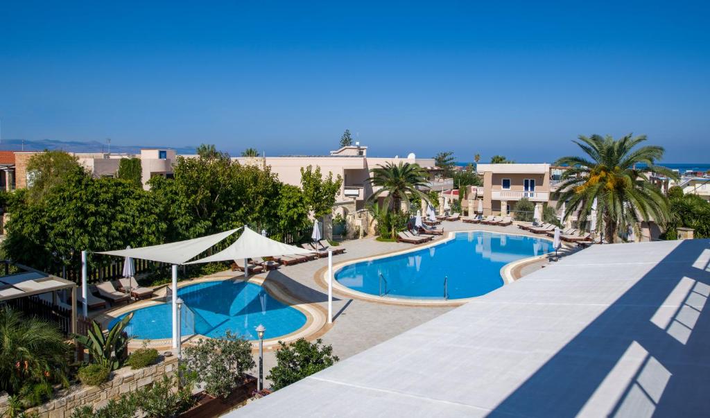 an image of a swimming pool at a resort at Isida Hotel Agia Marina in Agia Marina Nea Kydonias