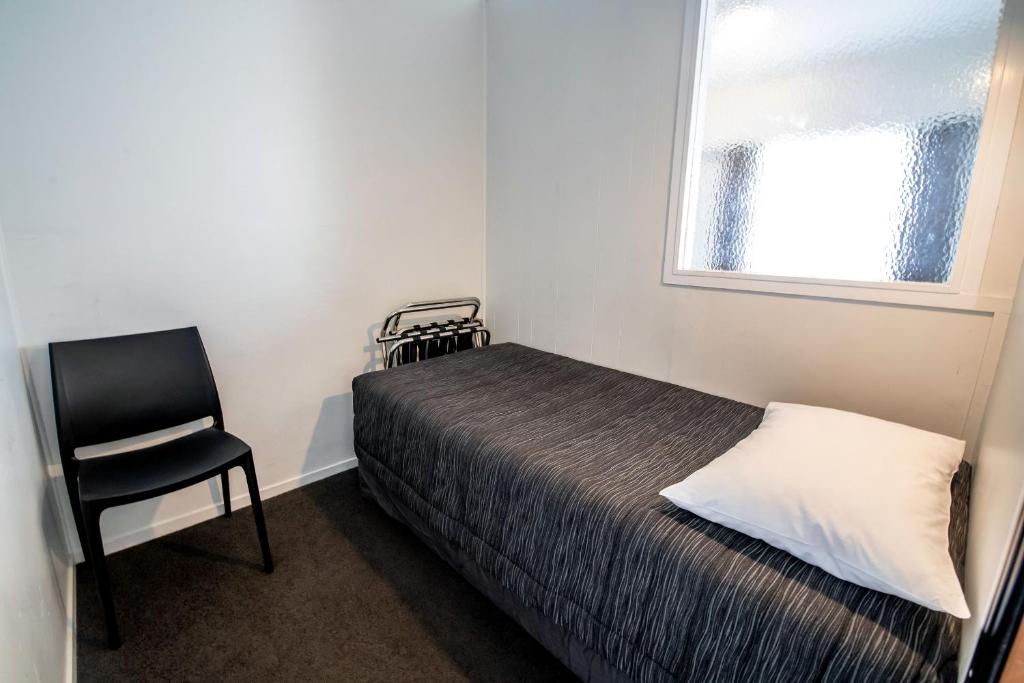 Postel nebo postele na pokoji v ubytování Aura Accommodation