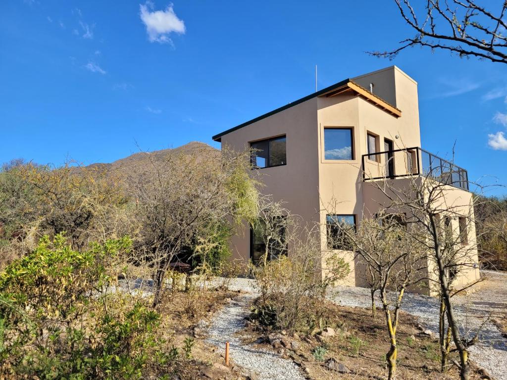 a house on the side of a hill at Cabañas Lofts de Caminos al Ser in Capilla del Monte