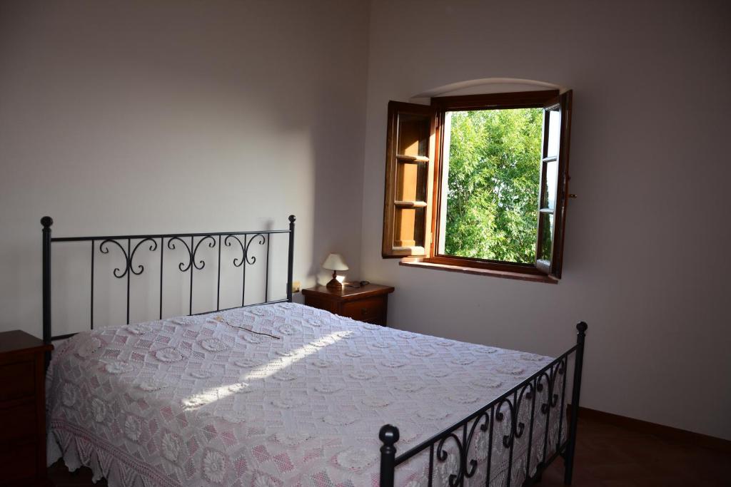 Łóżko lub łóżka w pokoju w obiekcie Agriturismo Podere Casalone