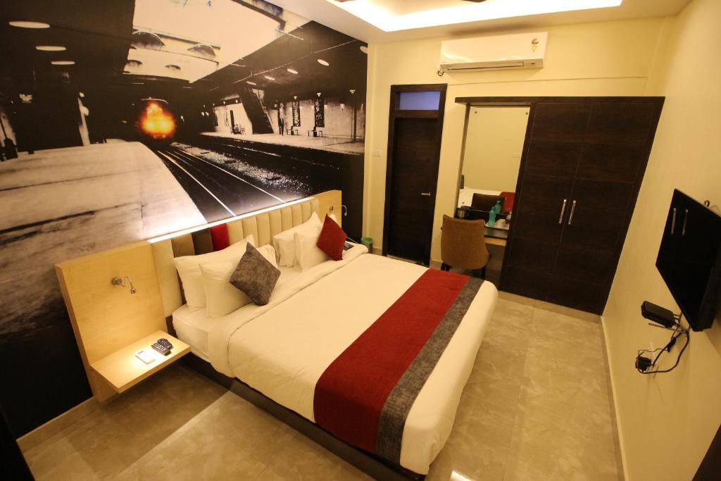 a hotel room with a bed with a train on it at The Butterfly Luxury Serviced Apartments in Visakhapatnam