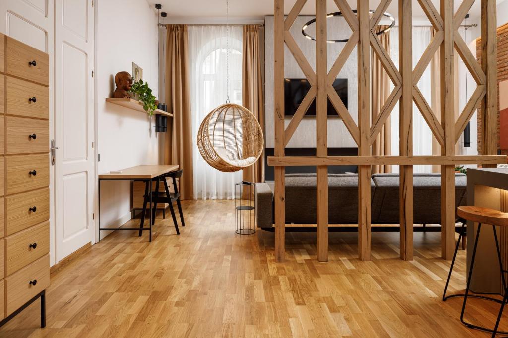 a living room with a bed and a desk at Ka'yana Apartments - Restored Luxury in the Heart of the Old Town, near Black Church, Council Sq in Braşov