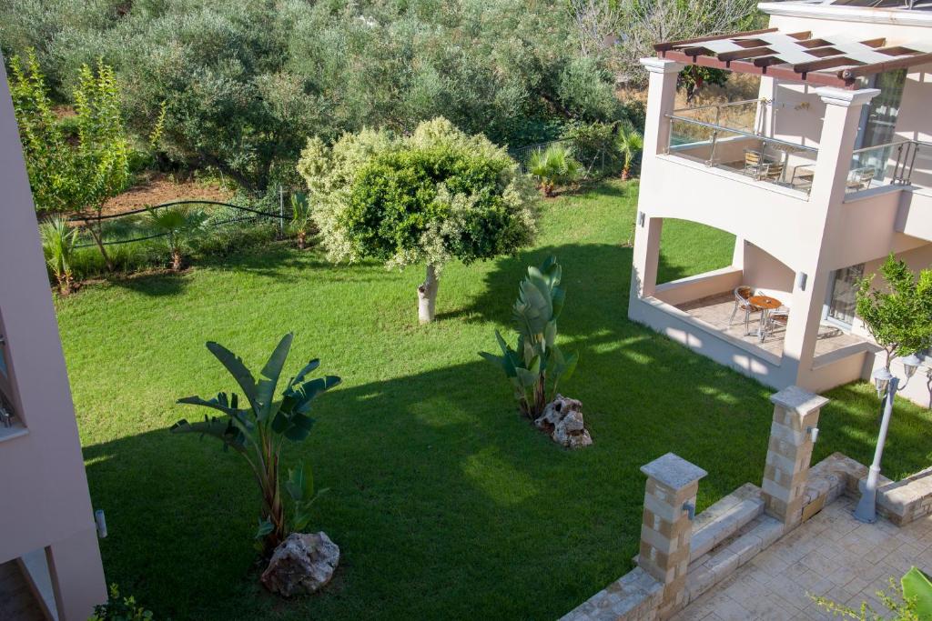 an aerial view of a yard with a house at Isida Hotel Agia Marina in Agia Marina Nea Kydonias