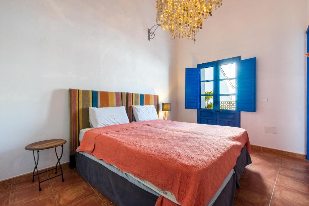 Postel nebo postele na pokoji v ubytování El Patio Andaluz