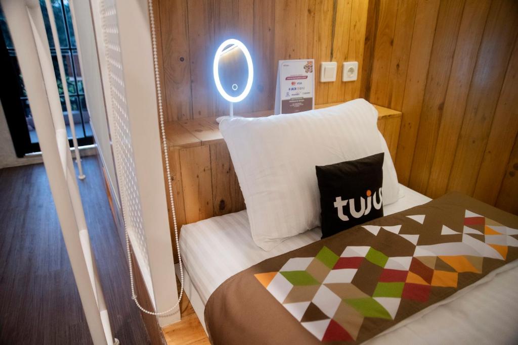 Postel nebo postele na pokoji v ubytování Tuju Arteri Pods