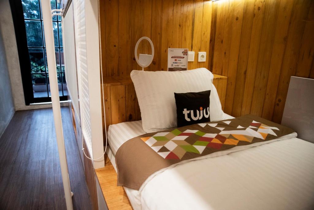 Postel nebo postele na pokoji v ubytování Tuju Arteri Pods