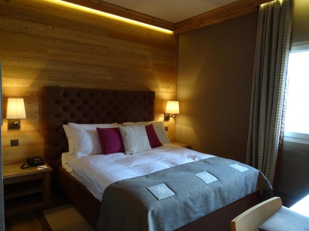 Postel nebo postele na pokoji v ubytování Hotel Royal