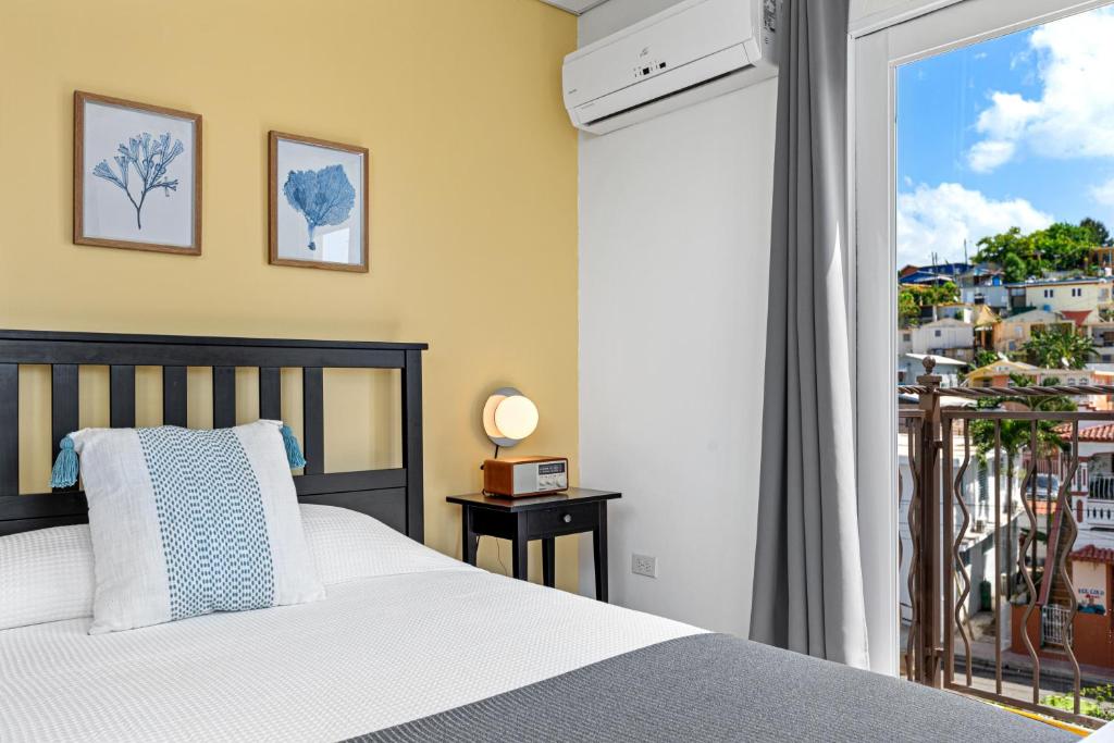 Postel nebo postele na pokoji v ubytování Rincon Plaza Hotel